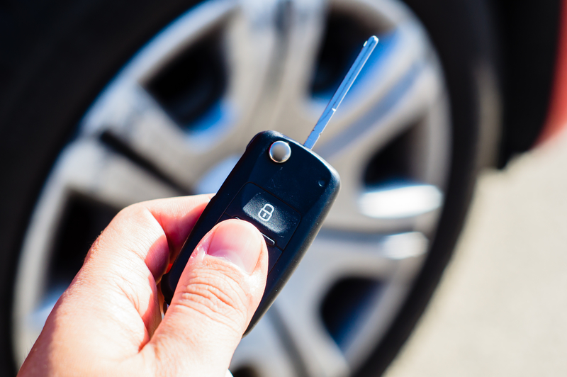 hand holding a car key